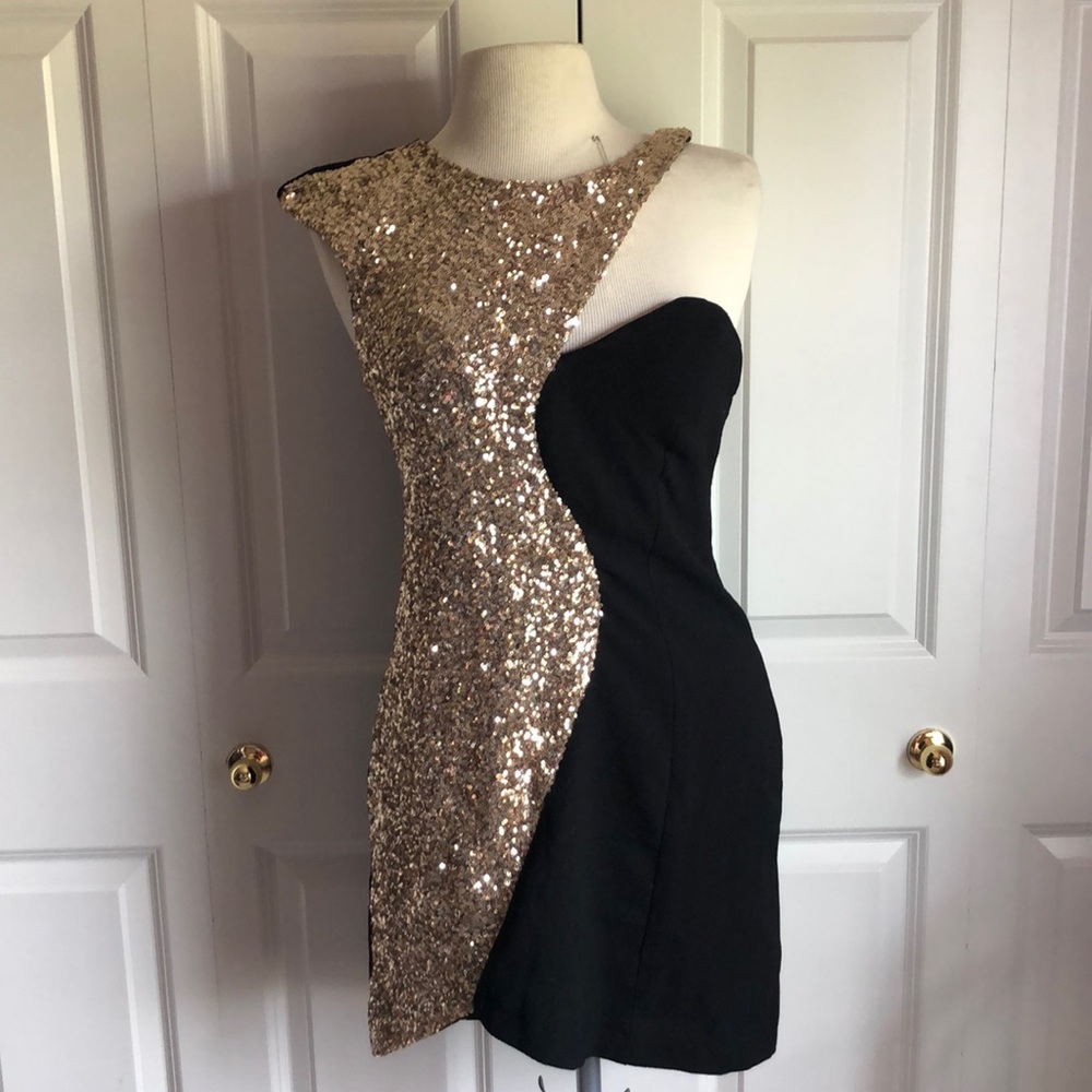 Black and gold form fitting formal dress